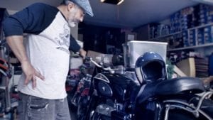 Steve Caballero with his Bike in the Garage